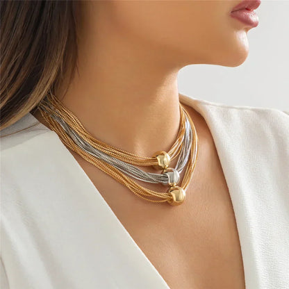 Nocturne draperat halsband med bollar