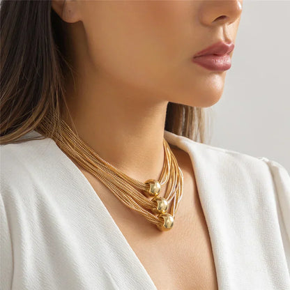 Nocturne draperat halsband med bollar